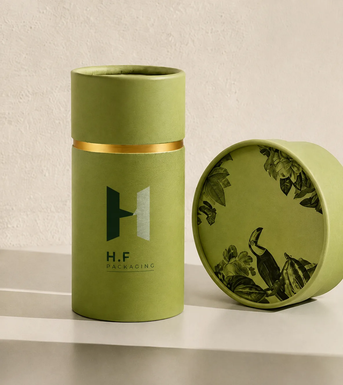Olive green round paper tube with H.F Packaging logo and botanical lid